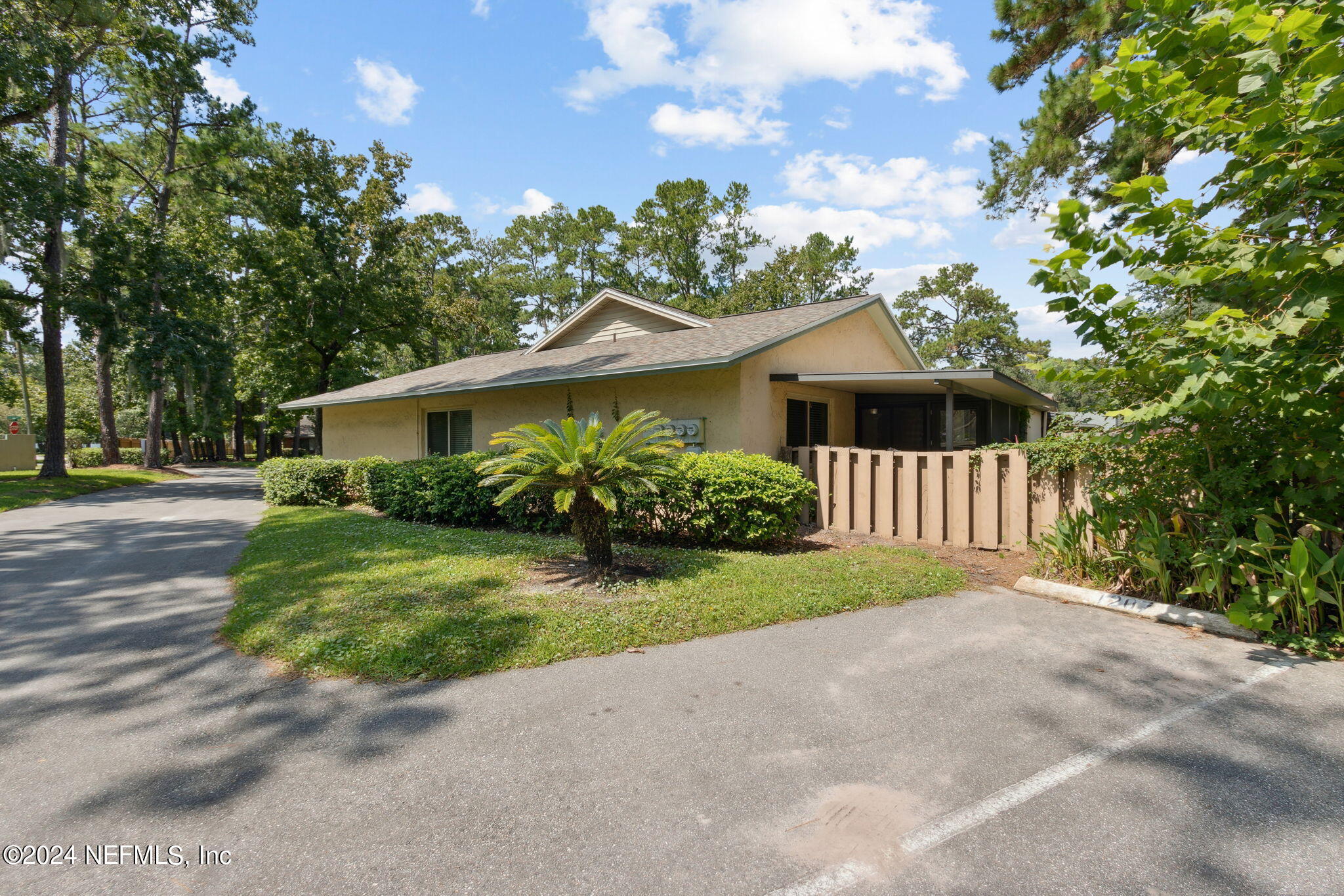 1213 The Grove Road Orange Park, FL 32073 - Photo 39 of 40 a front view of a house with a yard garage and outdoor seating