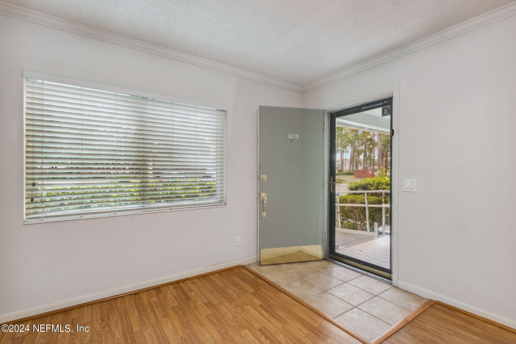 1213 The Grove Road Orange Park, FL 32073 - Photo 7 of 40 a view of an empty room with a window
