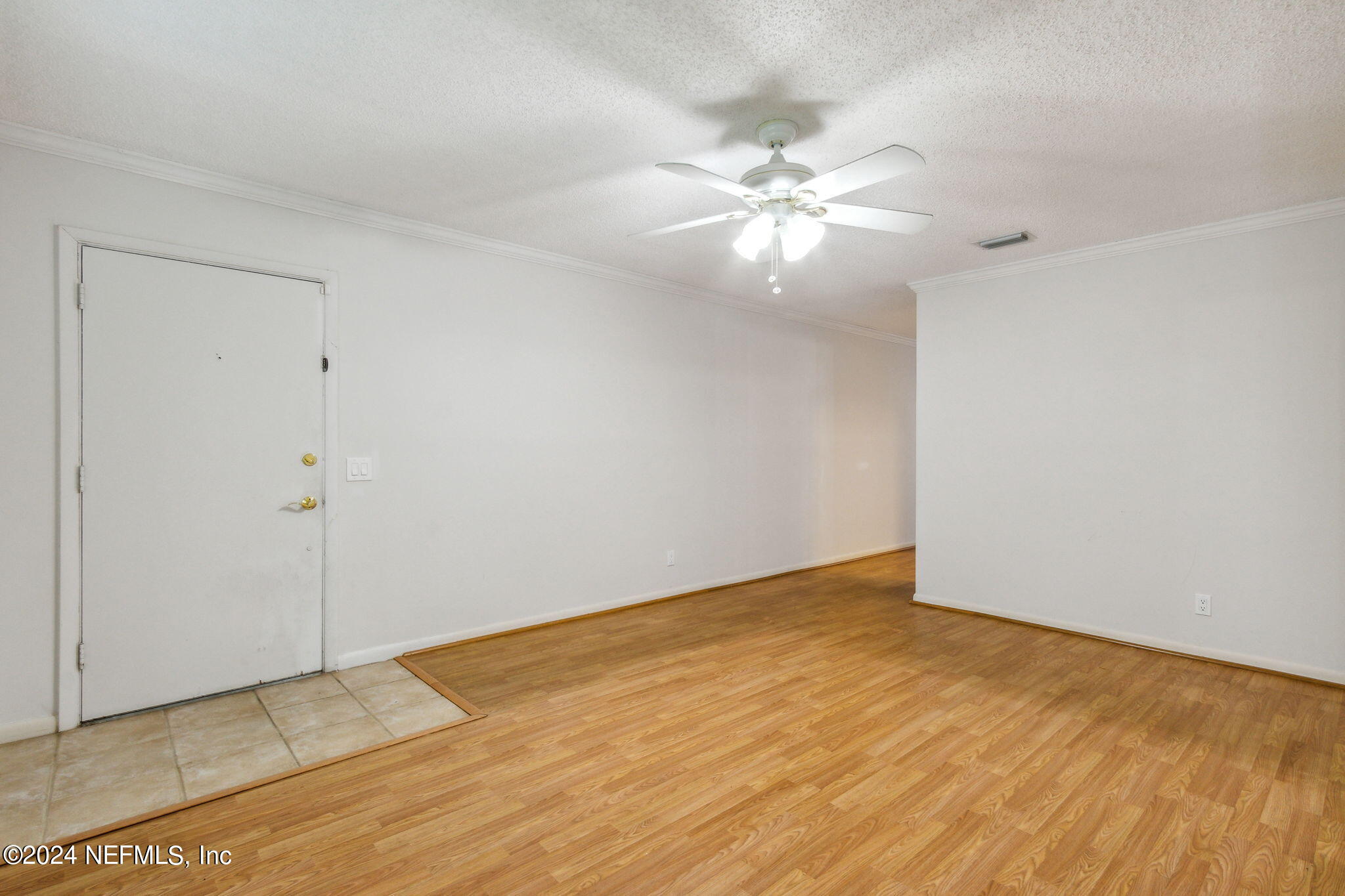 1213 The Grove Road Orange Park, FL 32073 - Photo 8 of 40 a view of an empty room with a fan