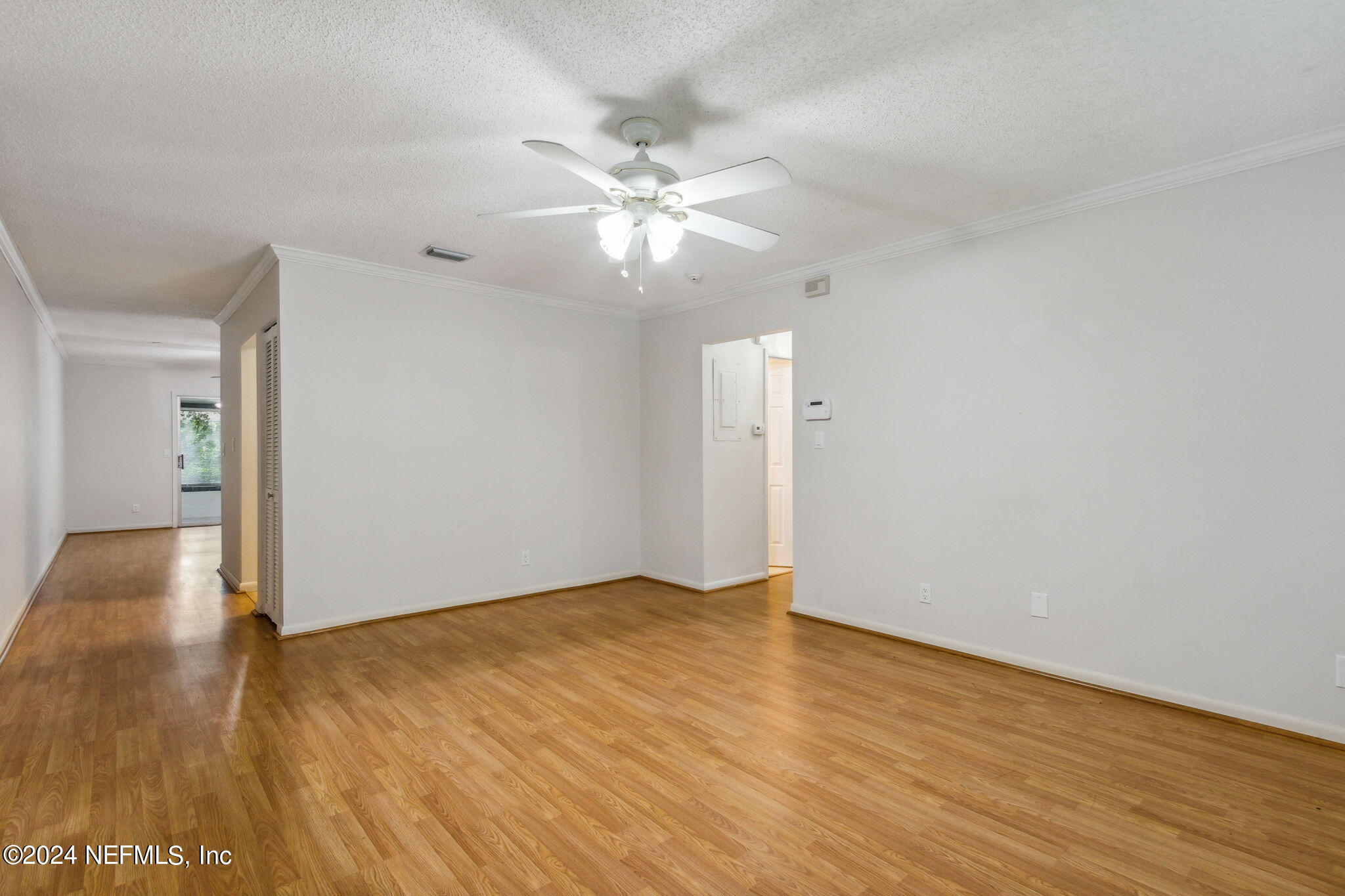 1213 The Grove Road Orange Park, FL 32073 - Photo 9 of 40 a view of an empty room with wooden floor