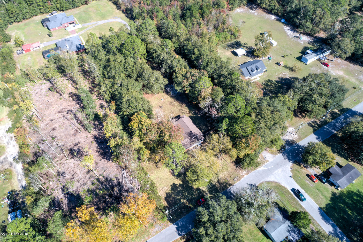 9301 Joos Road Jacksonville, FL 32220 - Photo 36 of 37 an aerial view of a house with a yard and garden