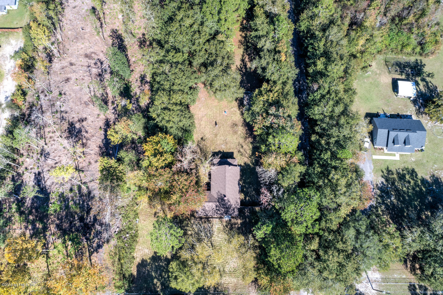 9301 Joos Road Jacksonville, FL 32220 - Photo 37 of 37 an aerial view of residential house with outdoor space and trees all around