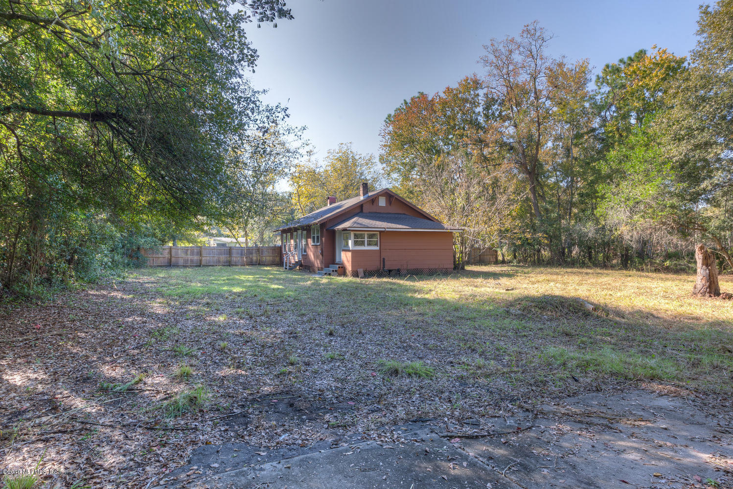 9301 Joos Road Jacksonville, FL 32220 - Photo 6 of 37 a view of a house with yard and tree s