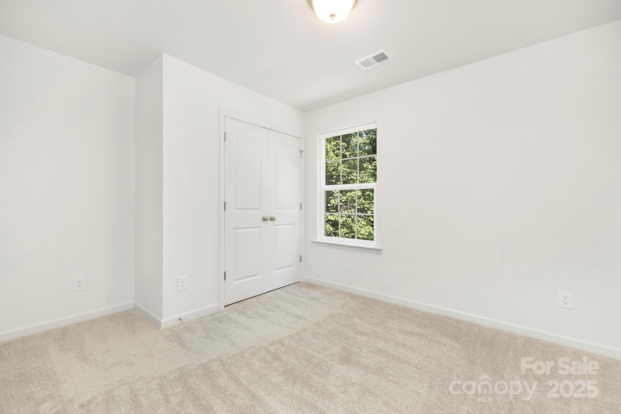 7601 Boswell Road Charlotte, NC 28215 - Photo 13 of 22 an empty room with a window