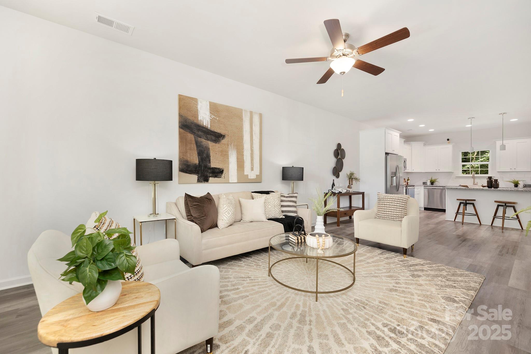7601 Boswell Road Charlotte, NC 28215 - Photo 3 of 22 a living room with furniture potted plant and a large window