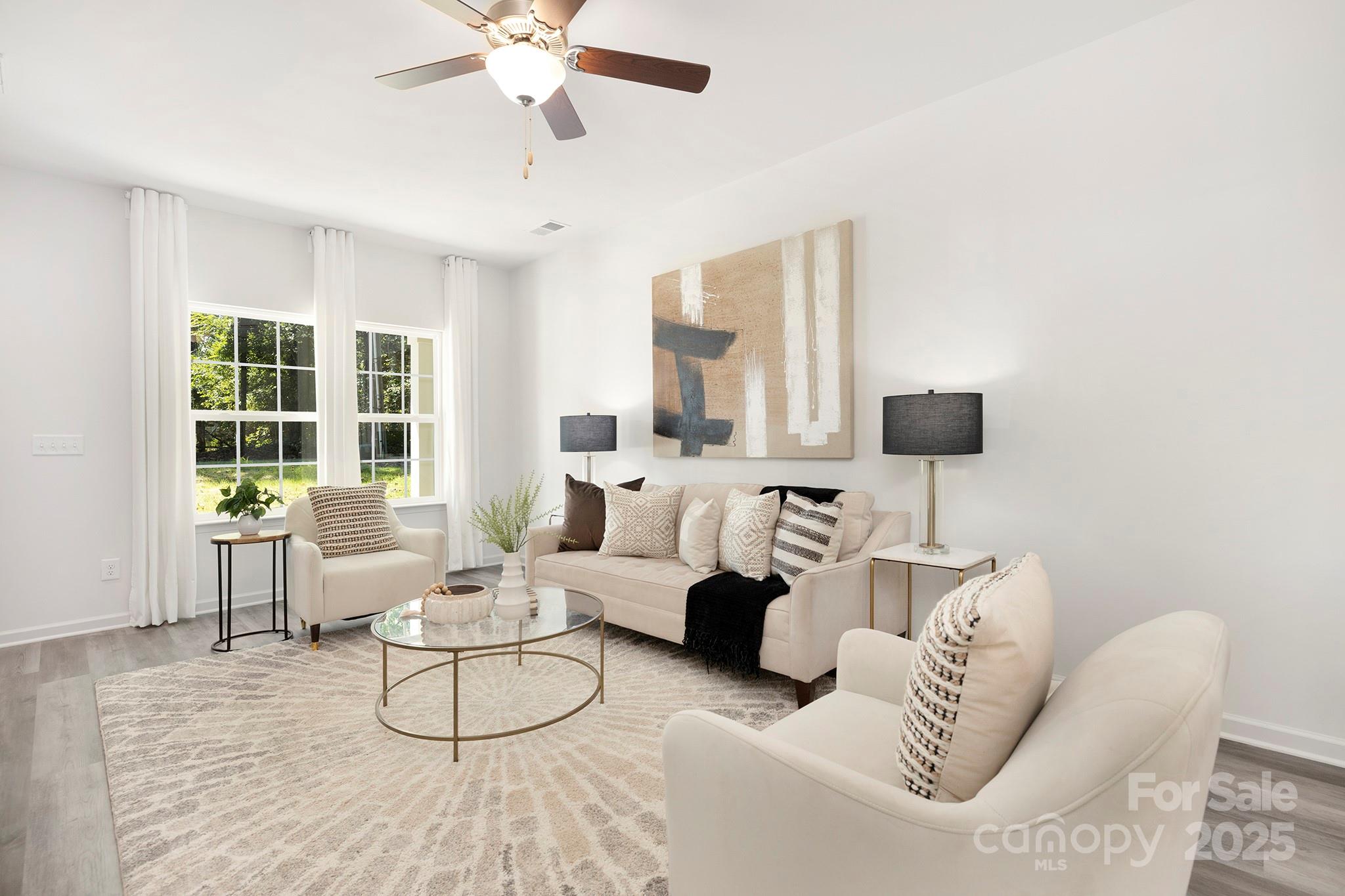7601 Boswell Road Charlotte, NC 28215 - Photo 4 of 22 a living room with furniture and a large window
