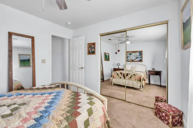 a bathroom with a toilet and a shower curtain
