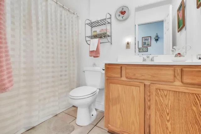 a view of a patio with table and chairs under an umbrella