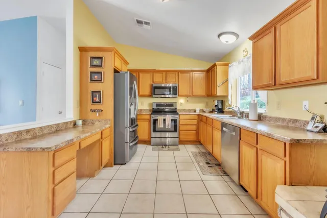 a view of a livingroom with furniture and a table