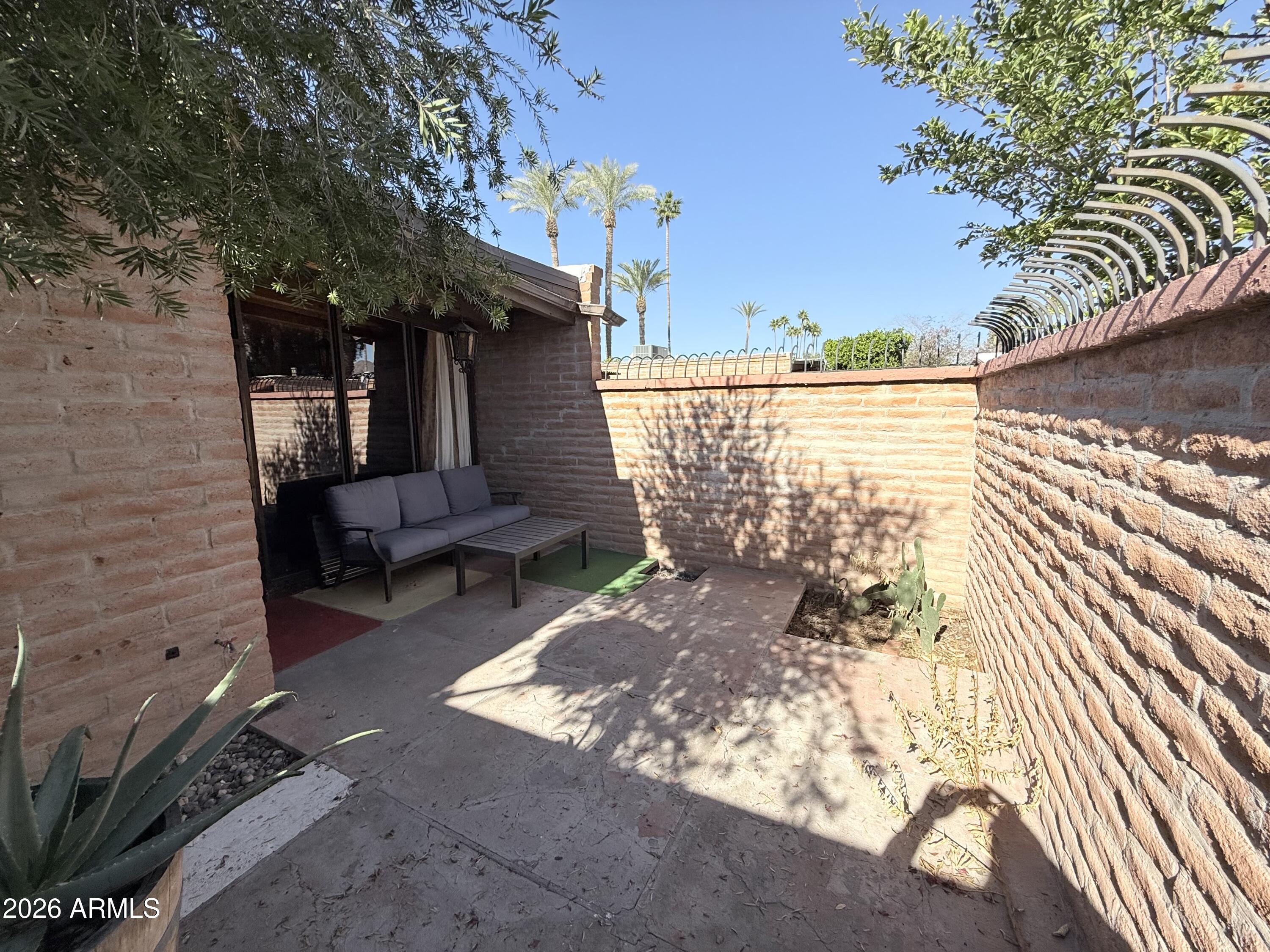 3032 North 32nd Street, Unit 65 Phoenix, AZ 85018 - Photo 15 of 22 a view of a backyard with sitting area