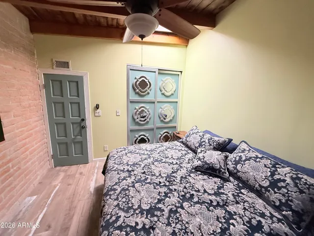 a bedroom with a bed and a window