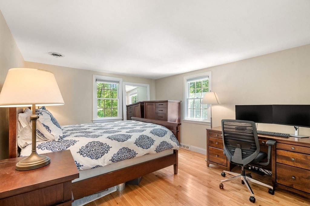 14 Sassamon Road Scituate, MA 02066 - Photo 14 of 28 a bedroom with a bed and a desk