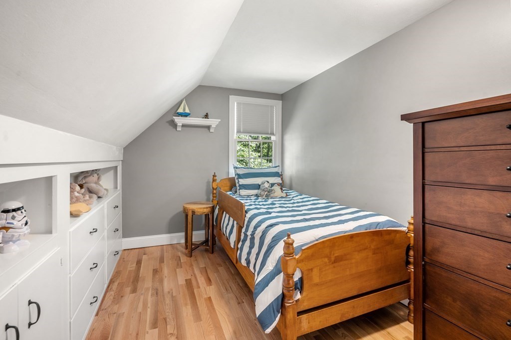 14 Sassamon Road Scituate, MA 02066 - Photo 15 of 28 a bedroom with a bed and a dresser