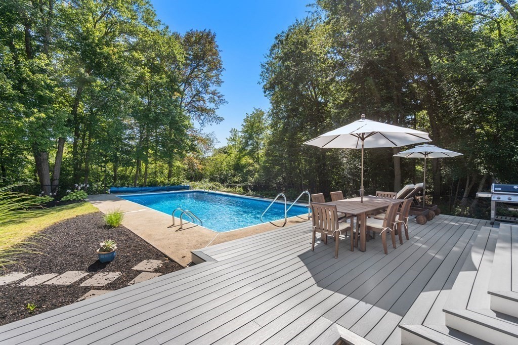 14 Sassamon Road Scituate, MA 02066 - Photo 22 of 28 a view of a swimming pool with a patio