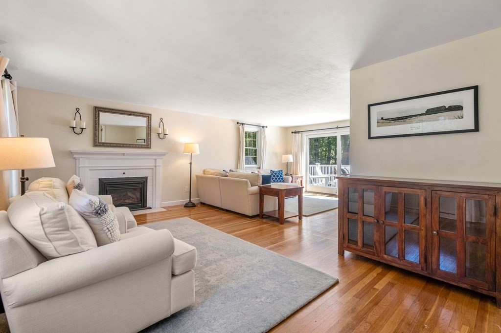 14 Sassamon Road Scituate, MA 02066 - Photo 5 of 28 a living room with furniture and a fireplace