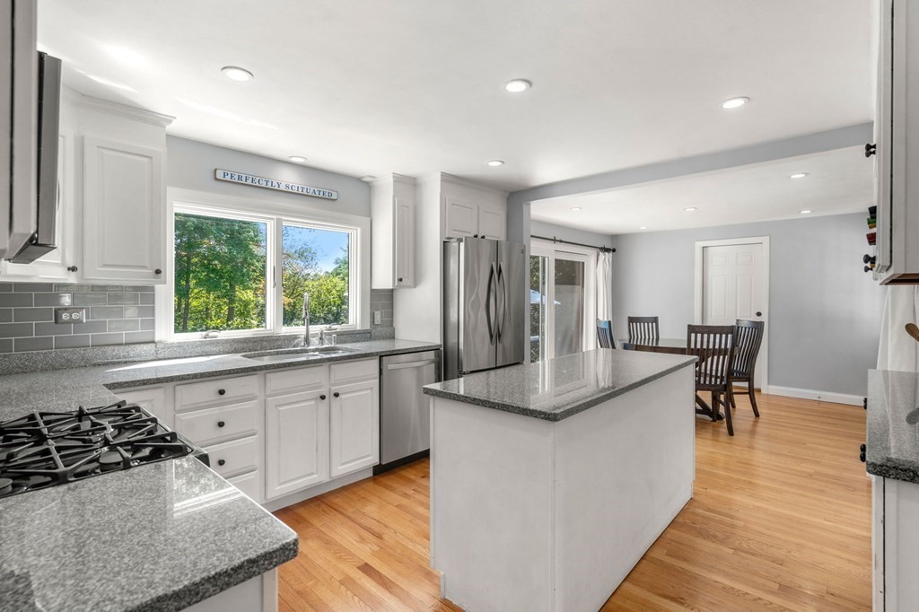 14 Sassamon Road Scituate, MA 02066 - Photo 6 of 28 a kitchen with stainless steel appliances granite countertop a sink stove and cabinets