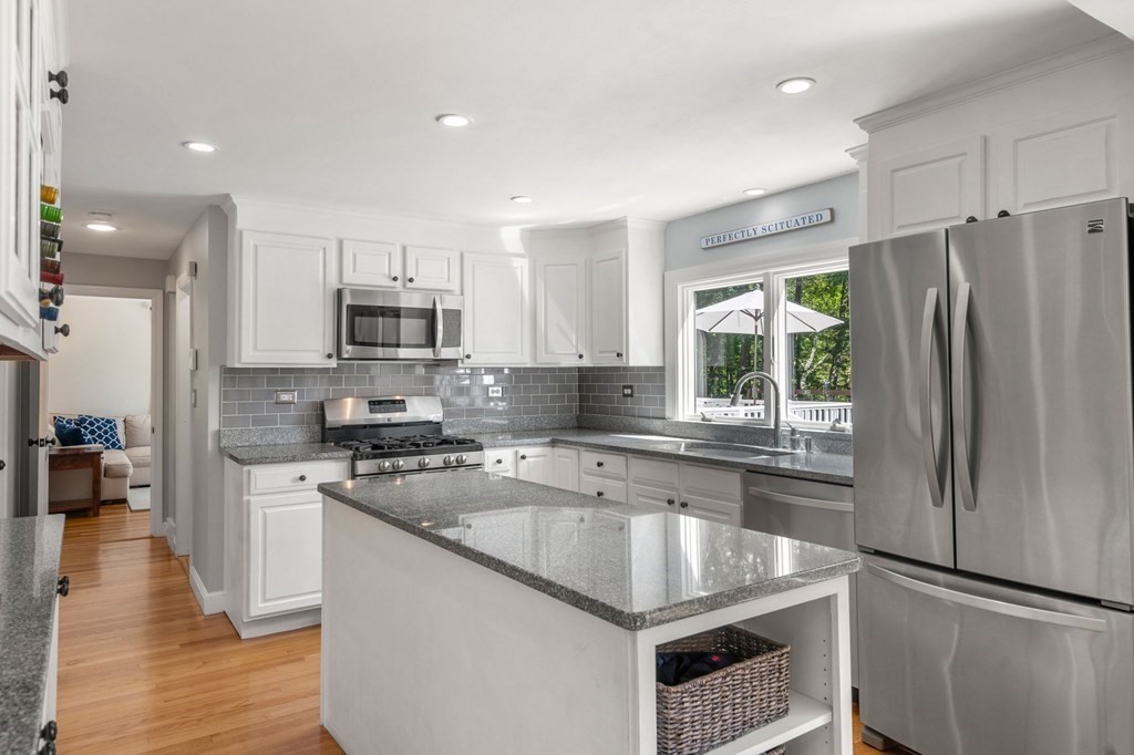 14 Sassamon Road Scituate, MA 02066 - Photo 8 of 28 a kitchen with stainless steel appliances granite countertop a refrigerator stove microwave and sink
