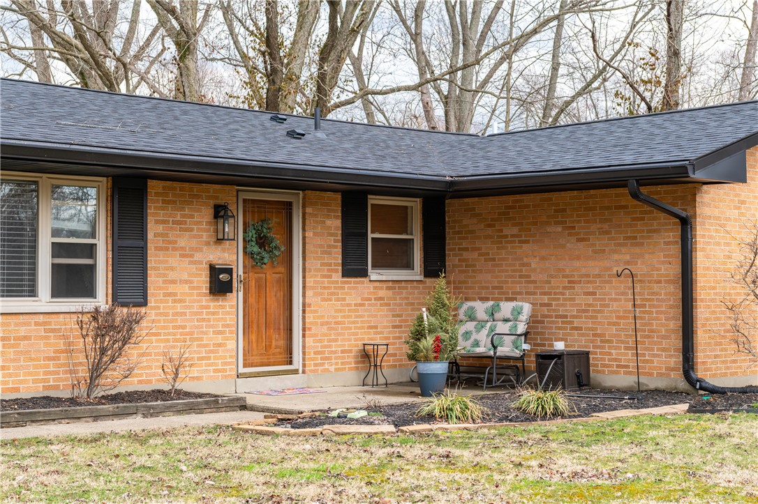 4102 Ridgetop Drive Bellbrook, OH 45305 - Photo 2 of 33 This charming residence features a classic brick exterior and an inviting front porch.