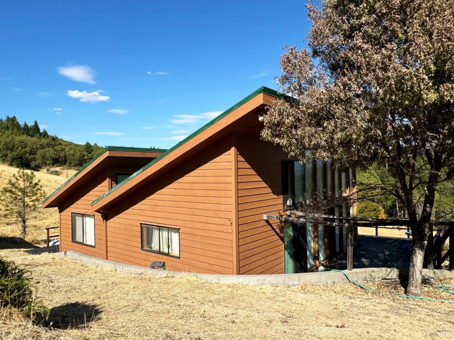 7200 3rd Gate Road Willits, CA 95490 - Photo 1 of 1 a view of a house with a yard