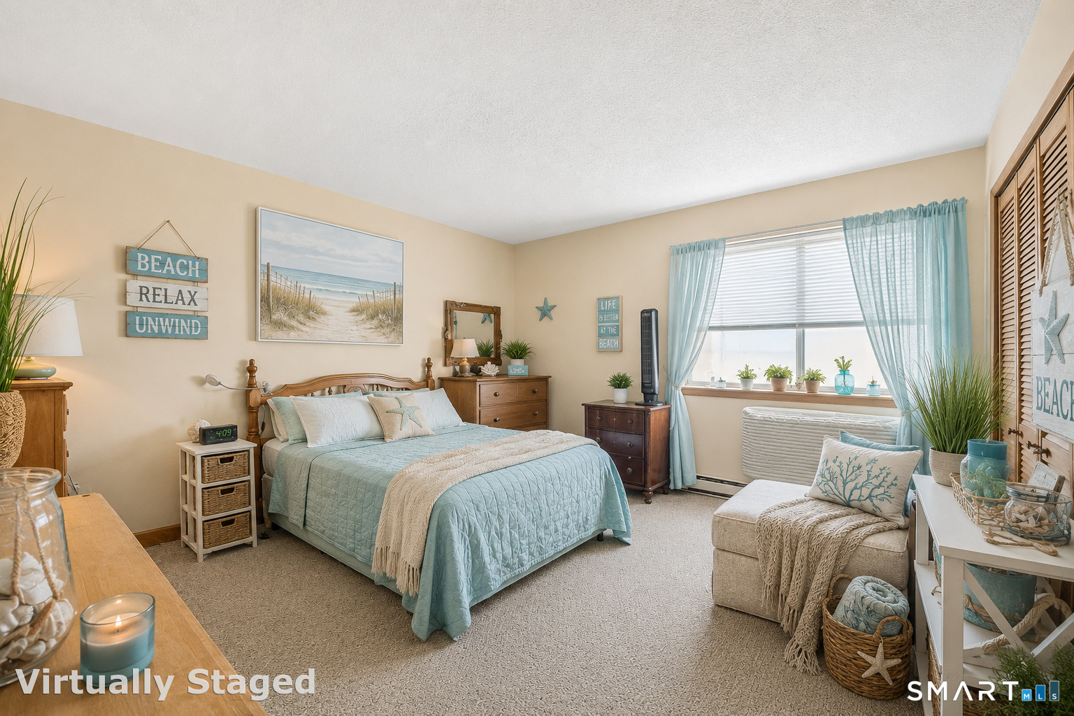 155 Short Beach Road, Unit 102 Stratford, CT 06615 - Photo 7 of 15 a bedroom with a bed and a large window