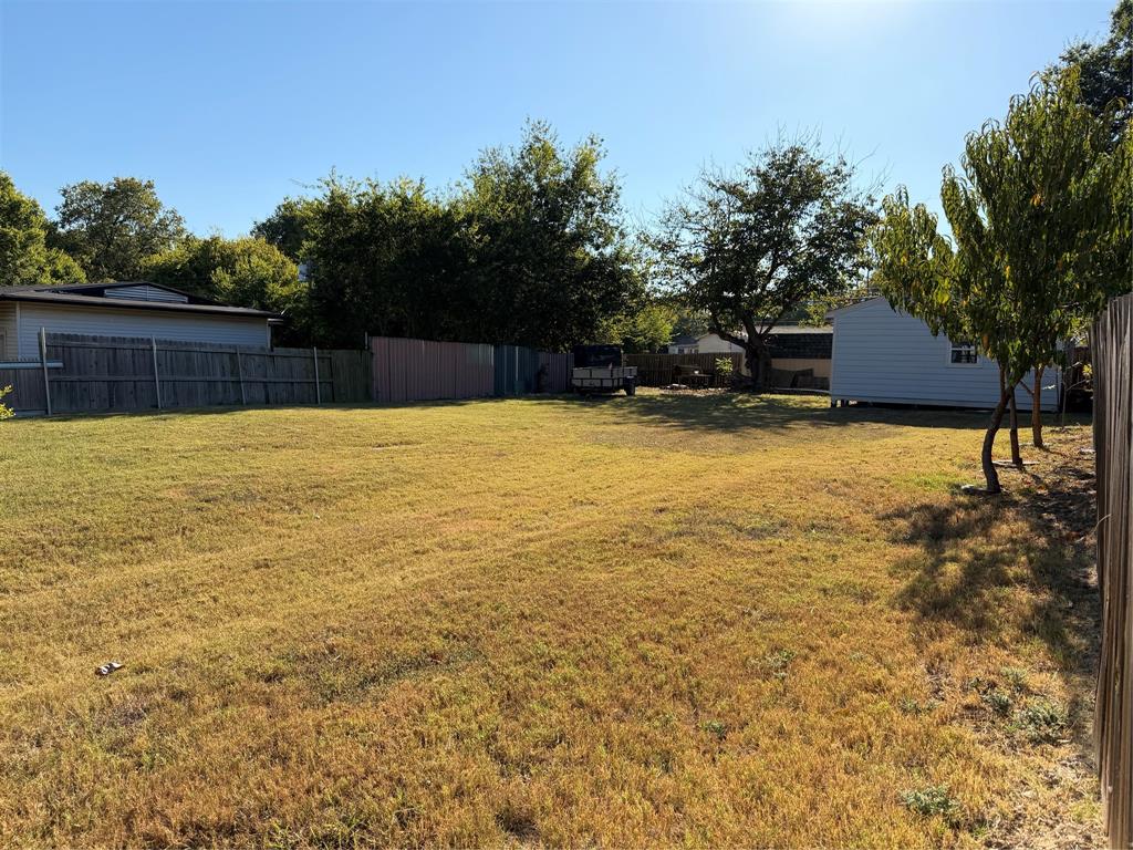 5127 Cardiff Street Dallas, TX 75241 - Photo 3 of 11 a backyard of a house