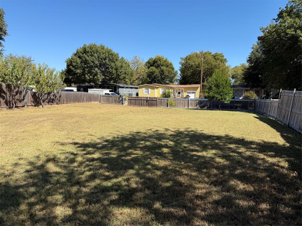 5127 Cardiff Street Dallas, TX 75241 - Photo 10 of 11 a view of a swimming pool with an outdoor space and seating area