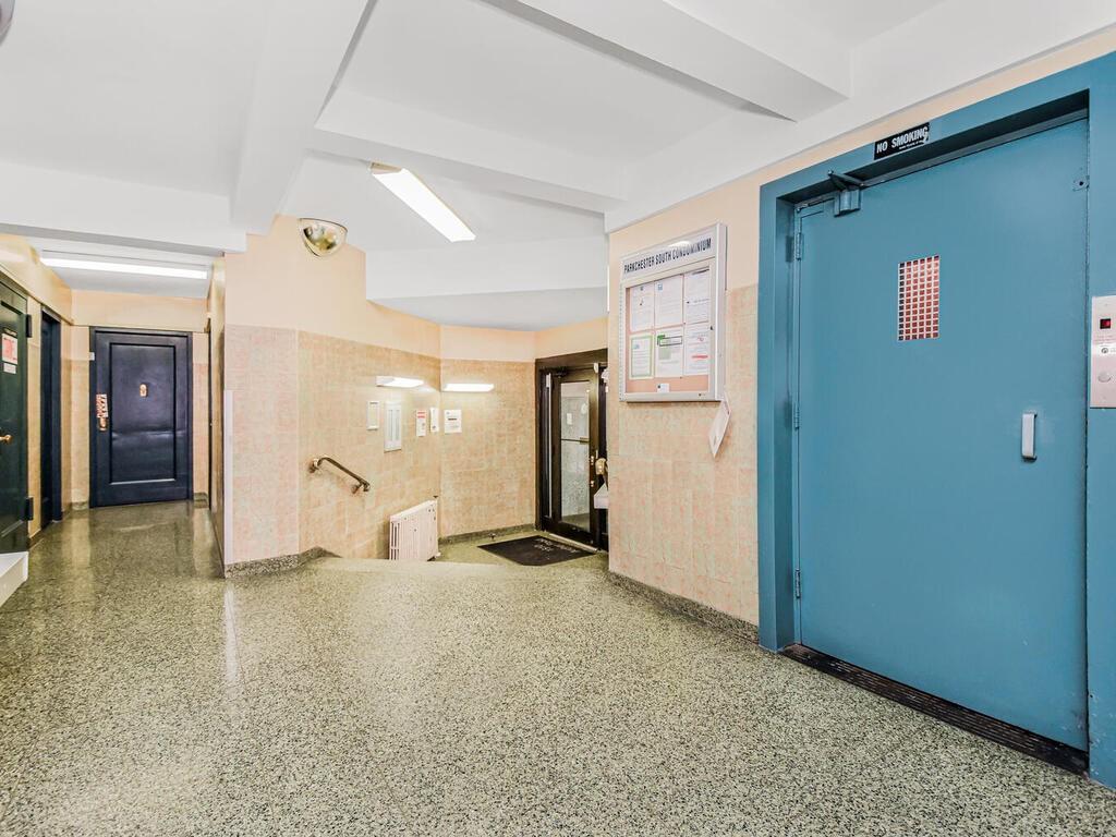 1510 Archer Road, Unit MF Bronx, NY 10462 - Photo 10 of 10 a view of a livingroom with wooden floor and kitchen space