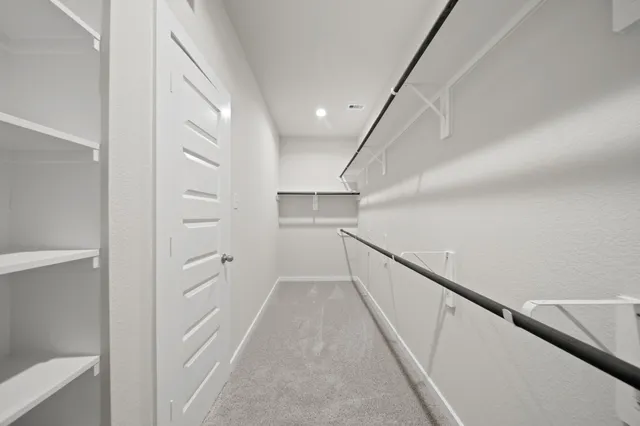 a white toilet sitting next to a bathroom sink