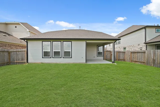 an aerial view of a house with a swimming pool