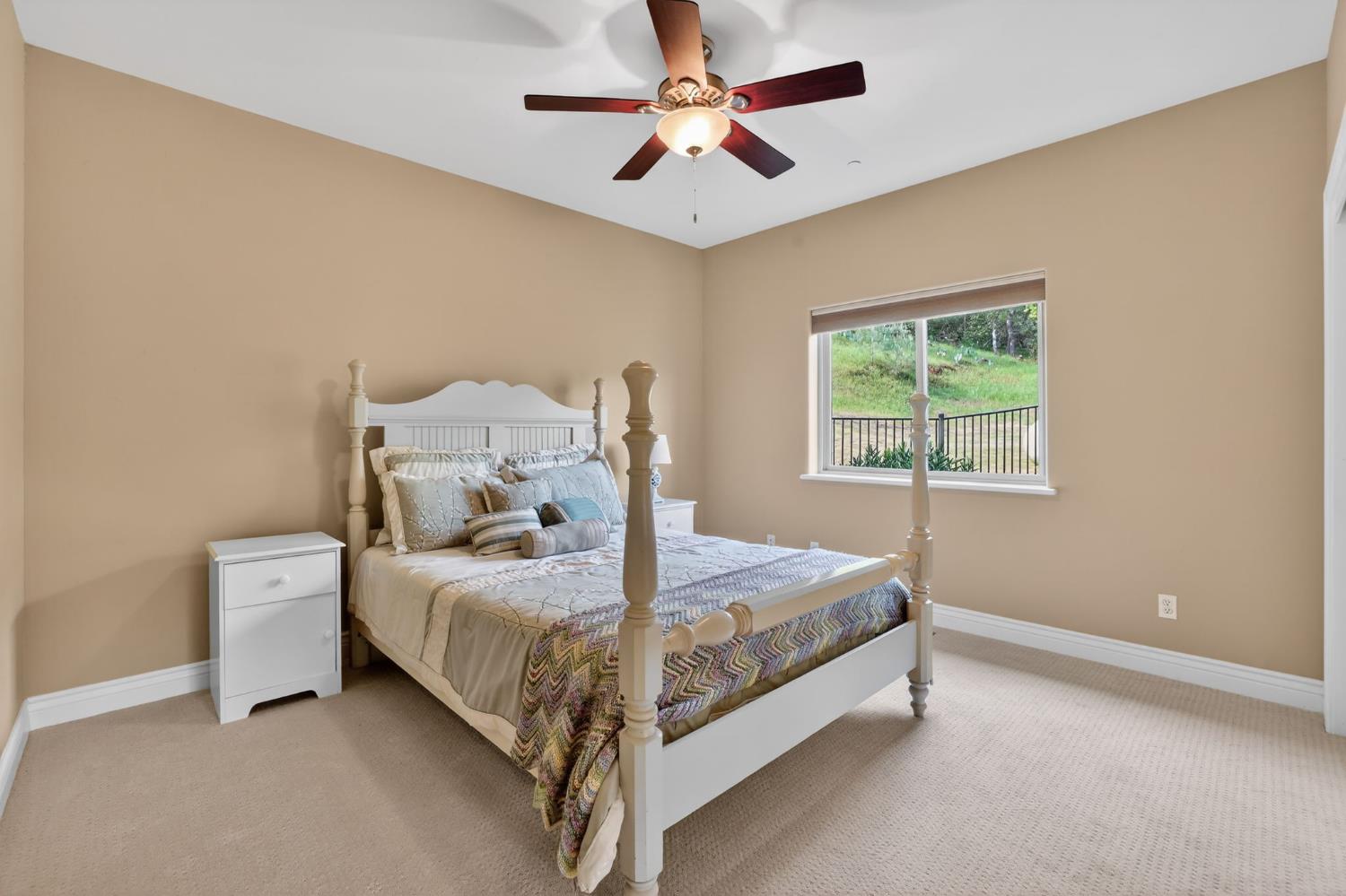 4554 Cross Creek Road Cool, CA 95614 - Photo 44 of 92 a bed sitting in a bedroom next to a window