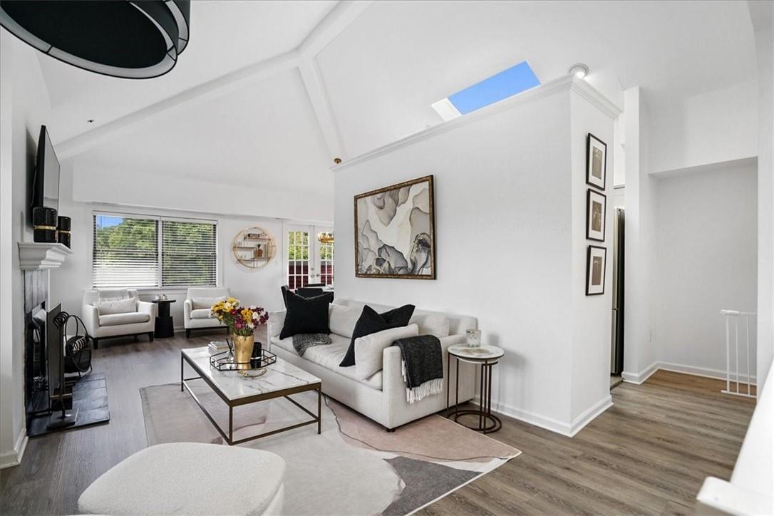 110 Theodore Fremd Avenue, Unit B9 Rye, NY 10580 - Photo 1 of 1 a living room with furniture and a large window