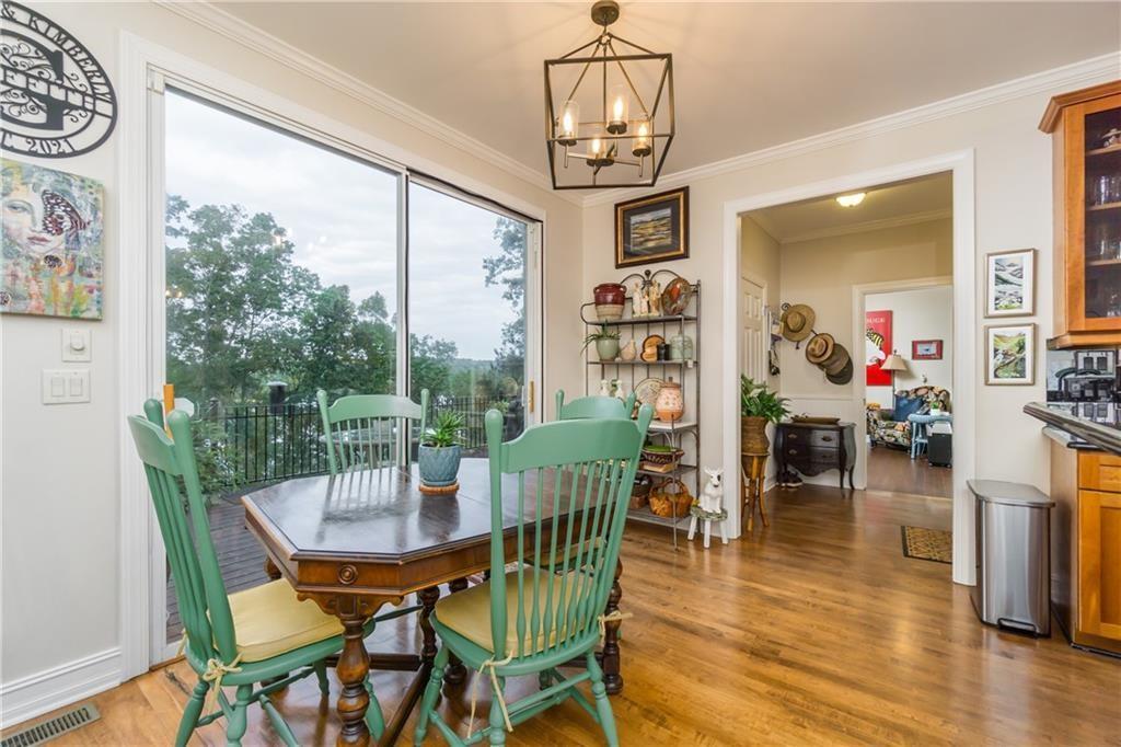 2819 Point Overlook Gainesville, GA 30501 - Photo 14 of 71 a view of a dining room with furniture wooden floor and chandelier
