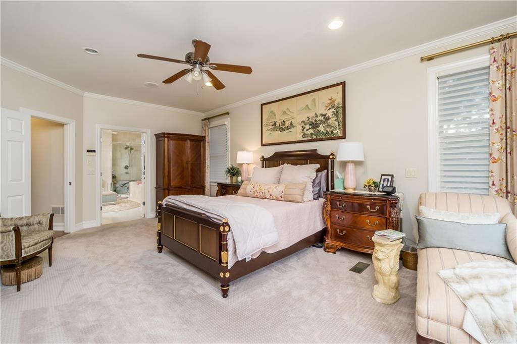 2819 Point Overlook Gainesville, GA 30501 - Photo 24 of 71 a bedroom with a bed and a chandelier