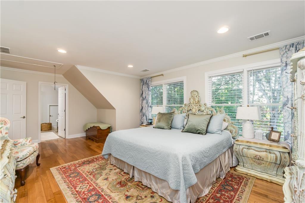 2819 Point Overlook Gainesville, GA 30501 - Photo 31 of 71 a bedroom with a large bed and a large window