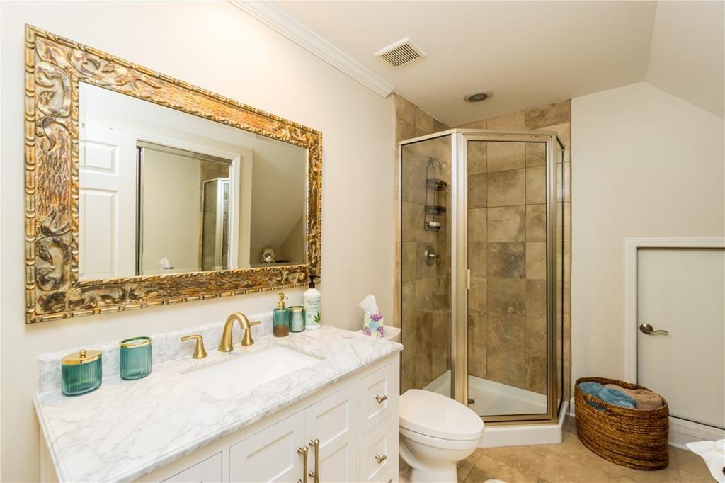 2819 Point Overlook Gainesville, GA 30501 - Photo 32 of 71 a bathroom with a granite countertop sink mirror vanity and toilet