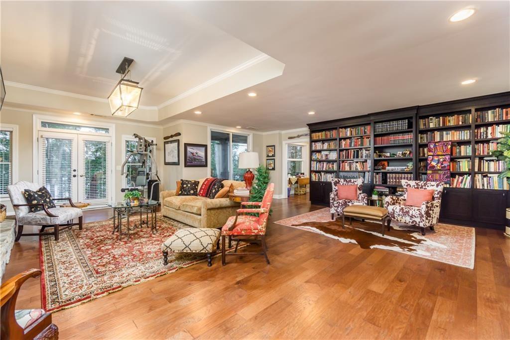 2819 Point Overlook Gainesville, GA 30501 - Photo 38 of 71 a living room with furniture gym equipment and a large window