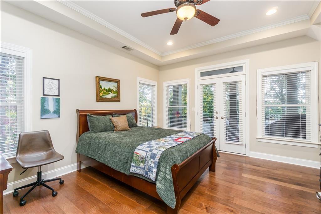 2819 Point Overlook Gainesville, GA 30501 - Photo 44 of 71 a bedroom with a bed window and a chair