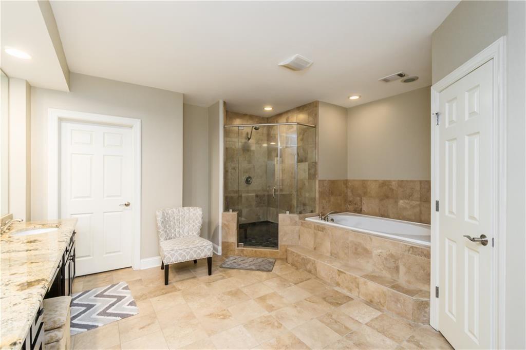 2819 Point Overlook Gainesville, GA 30501 - Photo 47 of 71 a spacious bathroom with a bathtub and a toilet