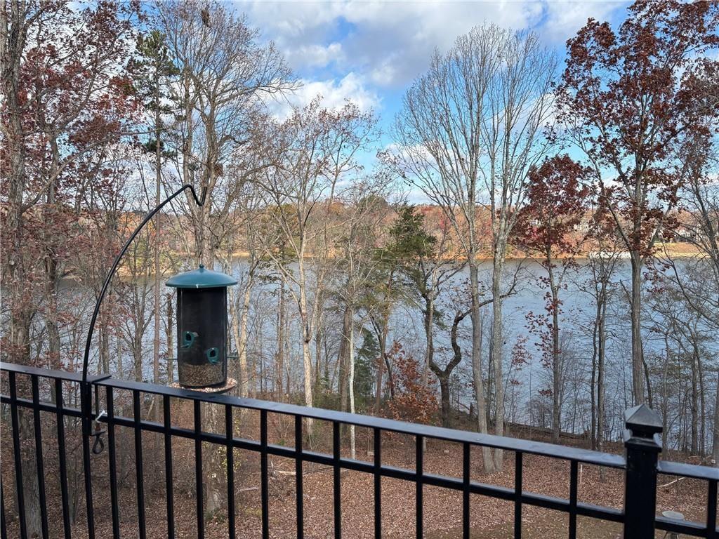 2819 Point Overlook Gainesville, GA 30501 - Photo 59 of 71 a view of a house with large trees and wooden fence