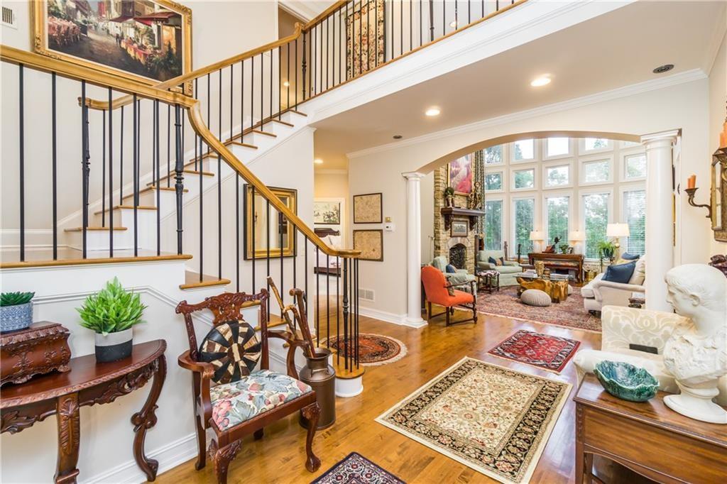 2819 Point Overlook Gainesville, GA 30501 - Photo 6 of 71 a living room with lots of furniture and a potted plant