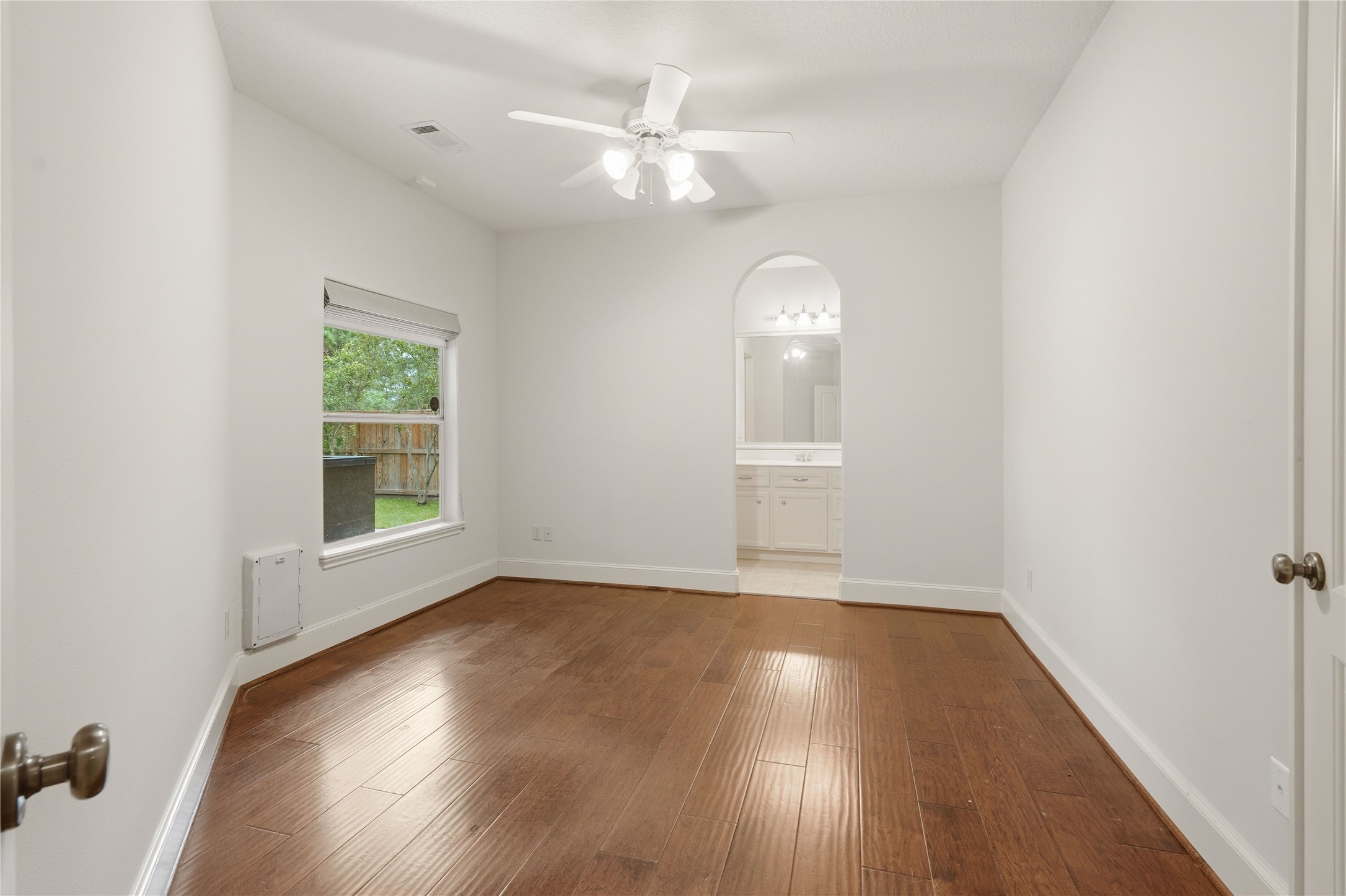 8111 Hideaway Lake Circle Spring, TX 77389 - Photo 30 of 48 wooden floor in an empty room with a window