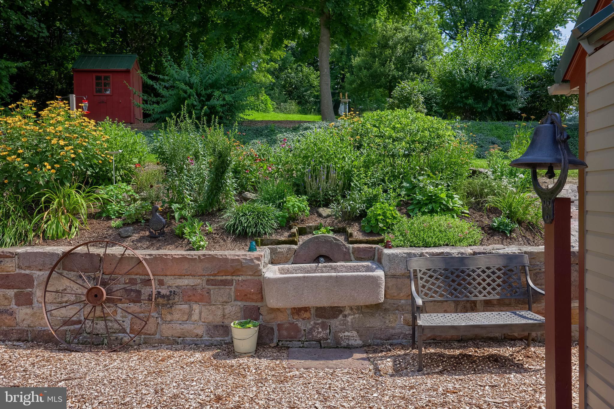 335 North Clay Road Lititz, PA 17543 - Photo 13 of 150 a view of a backyard with plants and a garden