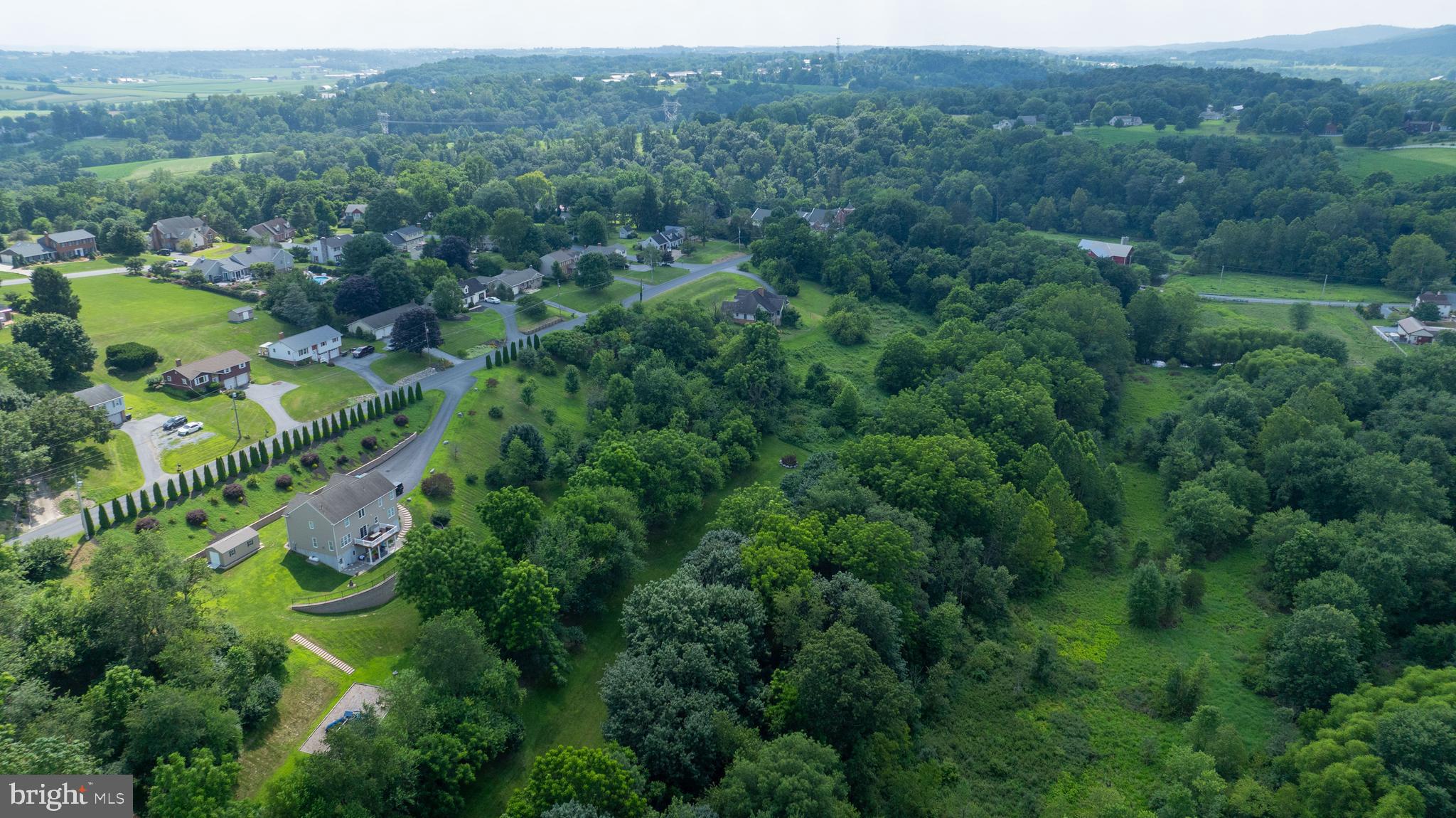 335 North Clay Road Lititz, PA 17543 - Photo 150 of 150 an aerial view of green landscape with trees houses and mountain view