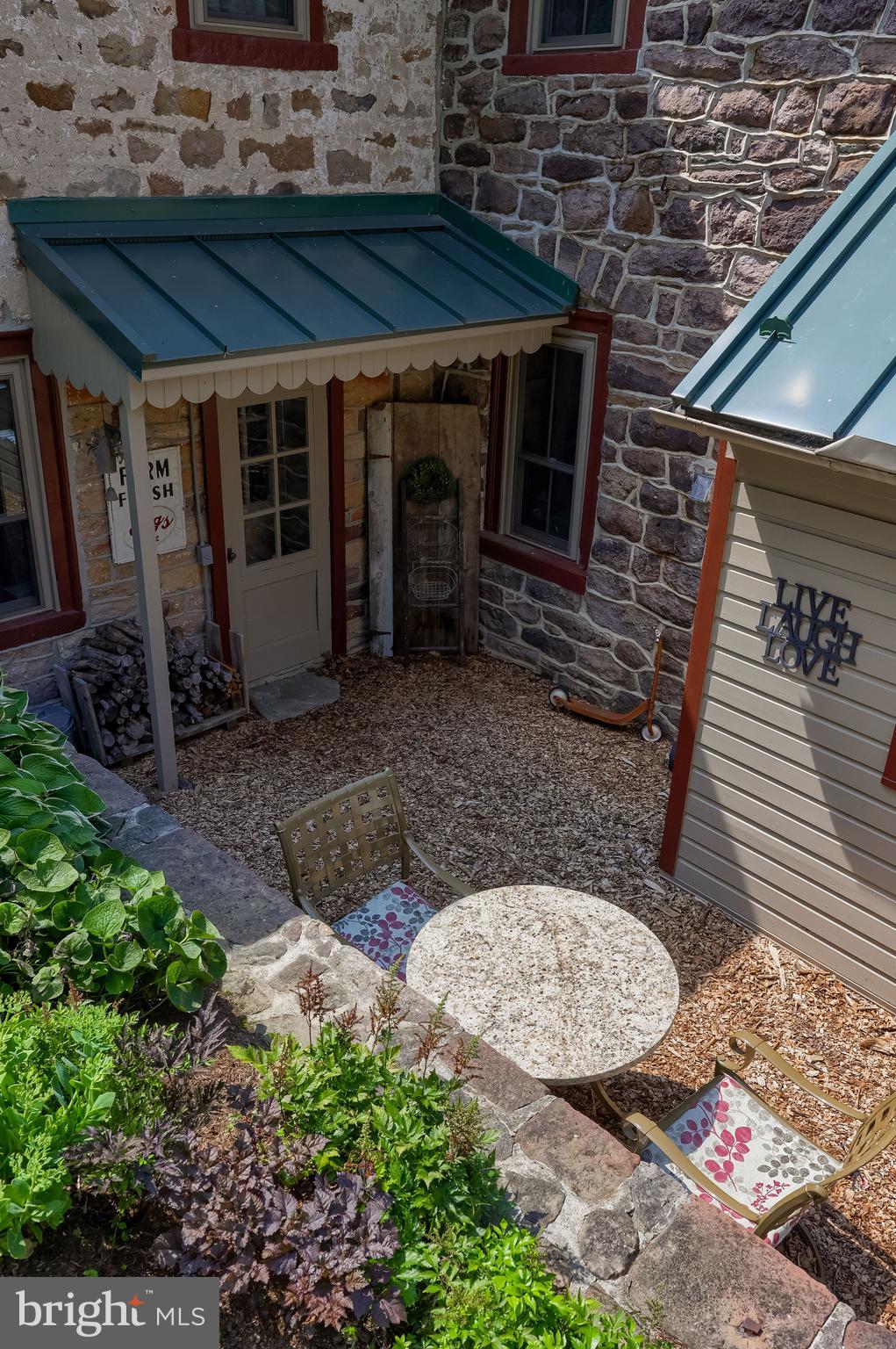 335 North Clay Road Lititz, PA 17543 - Photo 15 of 150 a view of a backyard with table and chairs a barbeque and potted plants