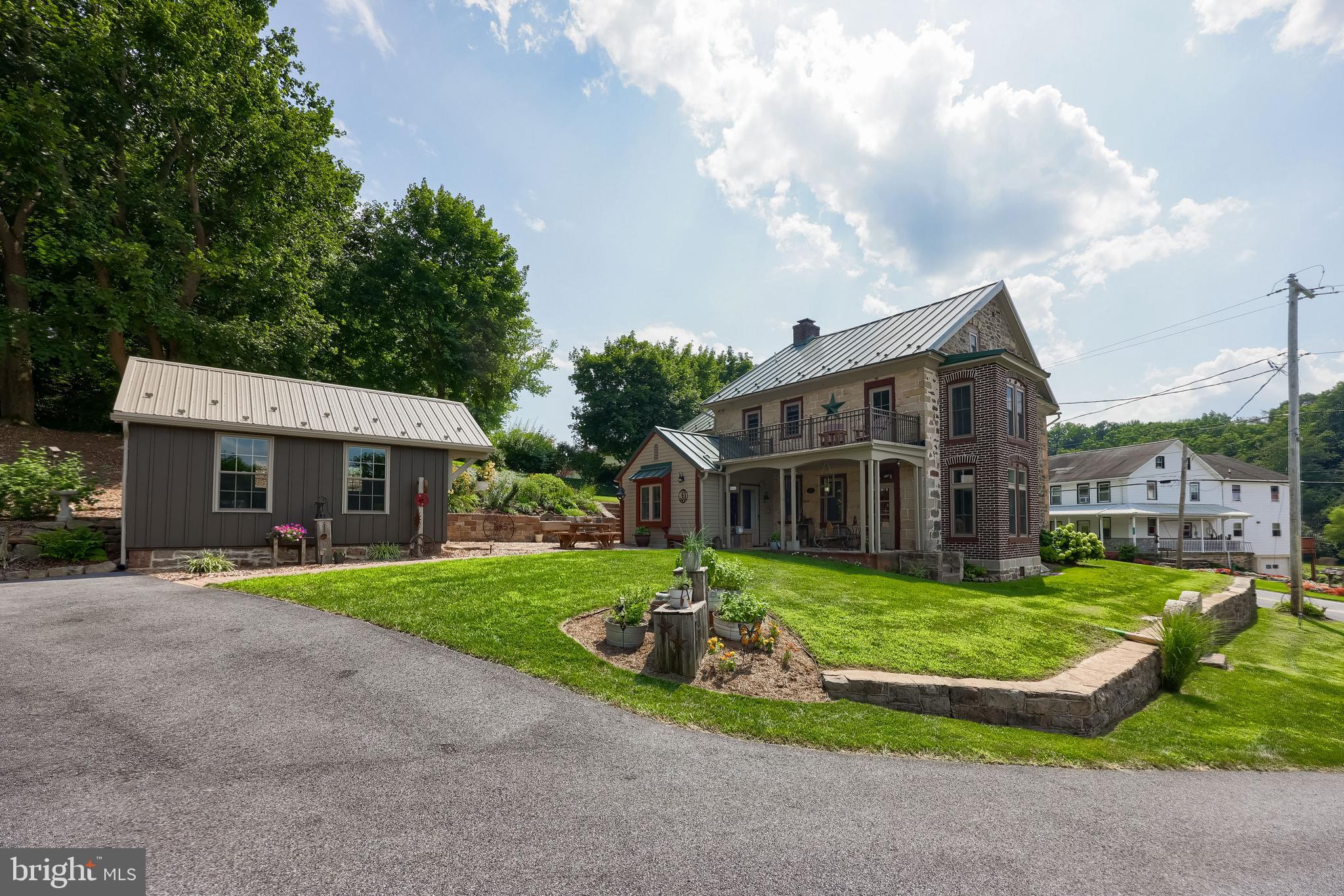 335 North Clay Road Lititz, PA 17543 - Photo 27 of 150 a view of a big house with a big yard and potted plants and large trees