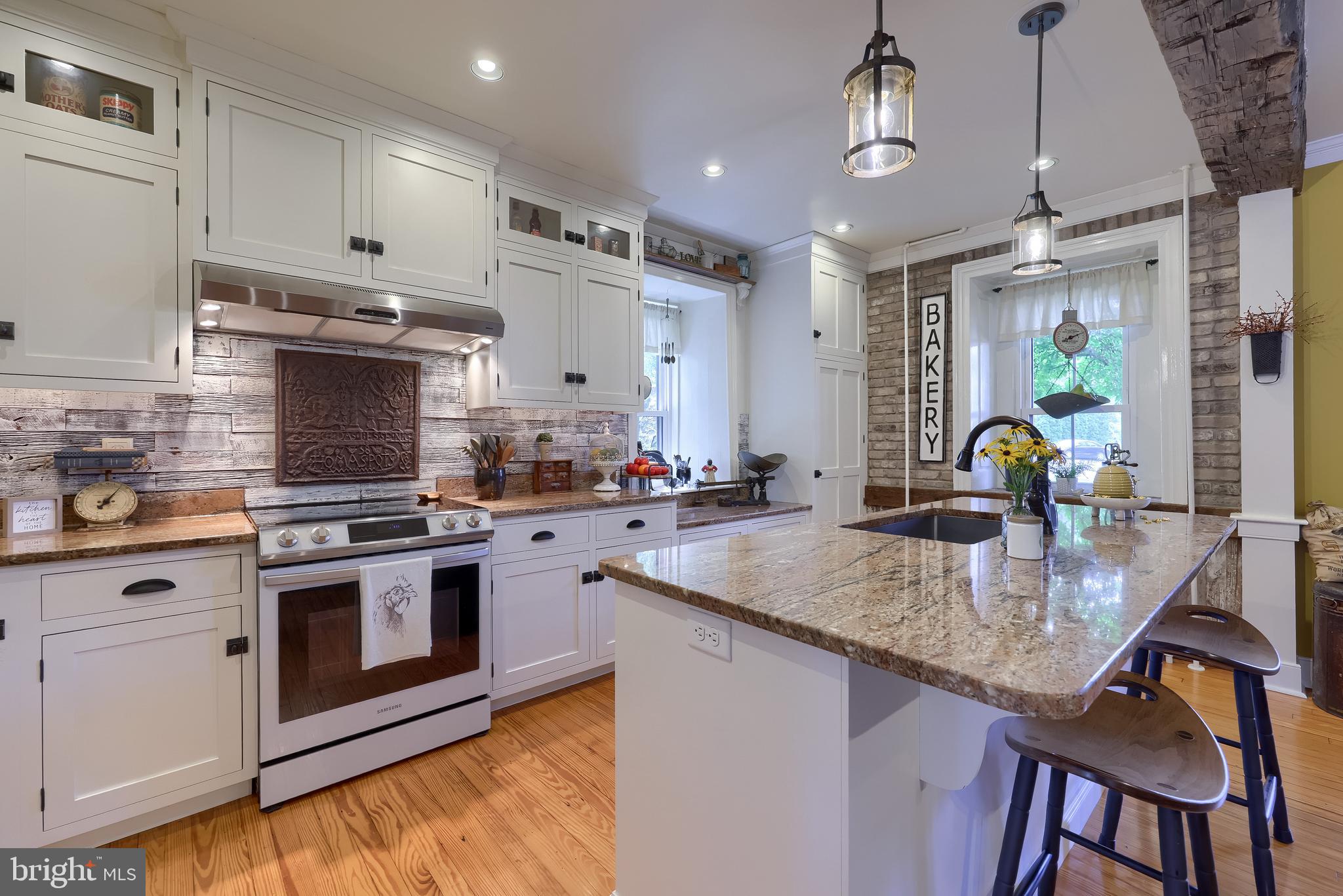 335 North Clay Road Lititz, PA 17543 - Photo 34 of 150 a kitchen with stainless steel appliances granite countertop a stove top oven a sink a counter space and cabinets
