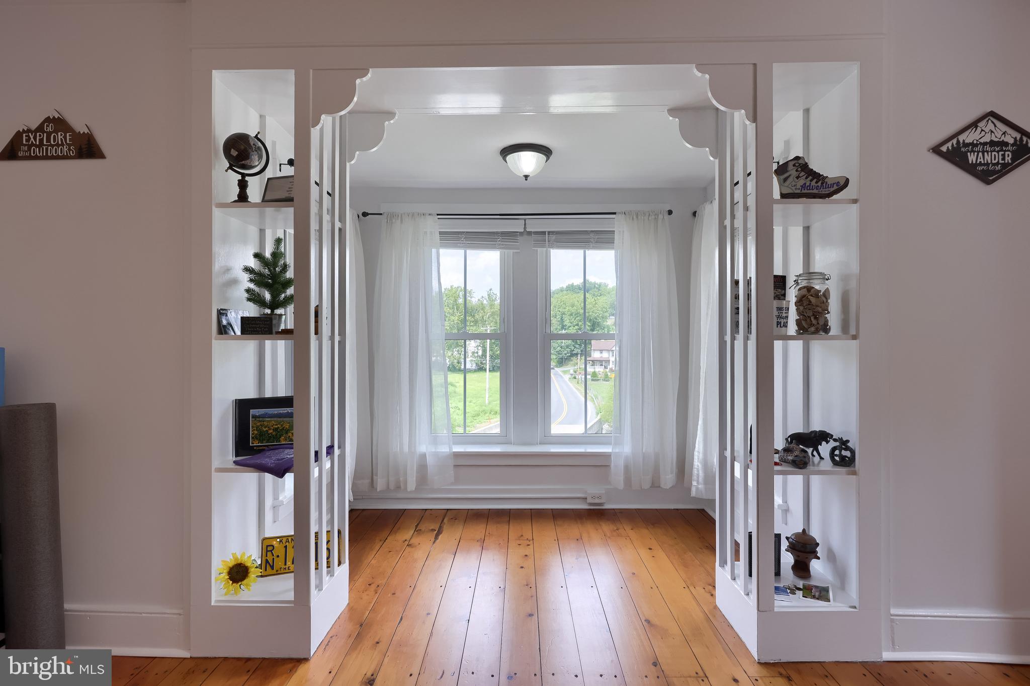 335 North Clay Road Lititz, PA 17543 - Photo 88 of 150 a view of a hallway with wooden floor and a living room