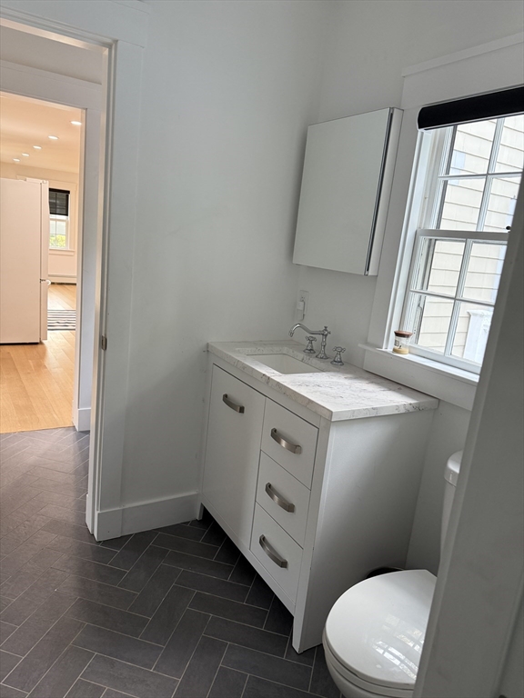 20 Hemlock Drive Canton, MA 02021 - Photo 12 of 14 a bathroom with a granite countertop toilet sink and mirror