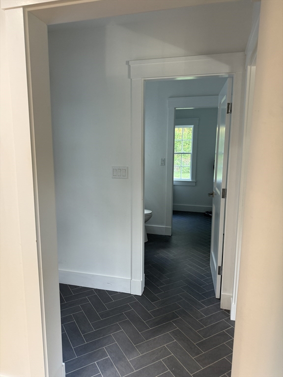 20 Hemlock Drive Canton, MA 02021 - Photo 13 of 14 a view of a hallway with wooden floor