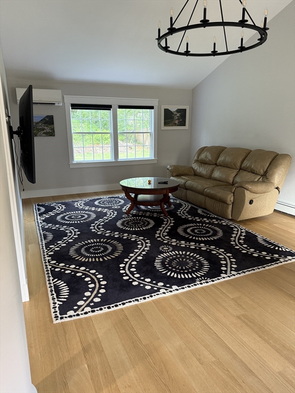 20 Hemlock Drive Canton, MA 02021 - Photo 14 of 14 a living room with a couch and a window